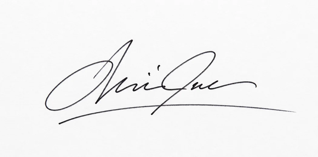 Fictional black signature photographed on clean white paper