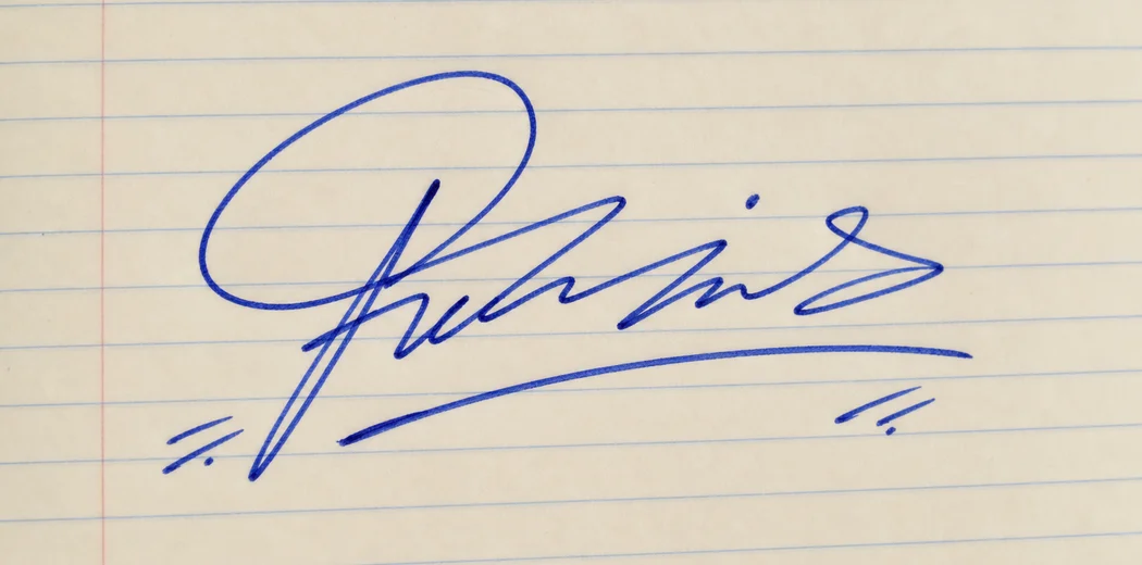 Fictional decorative blue signature written on lined notebook paper